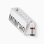 Caja de 12 ampollas de 6 ml de Moncho Moreno Hair Parachute, tratamiento capilar bifásico para combatir la caída y estimular el crecimiento saludable.