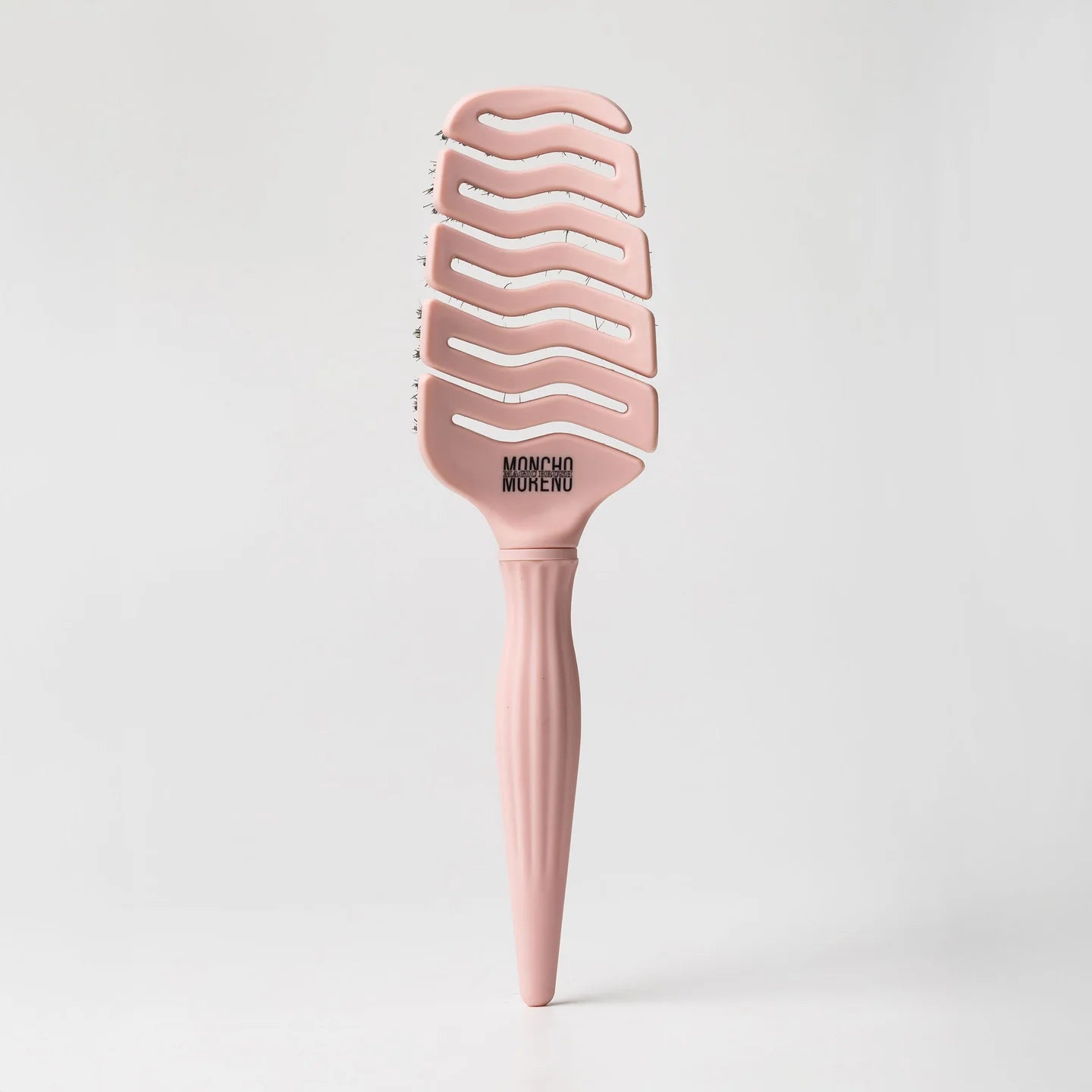 Cepillo Magic Brush Rosa de Moncho Moreno, mini y flexible, para desenredar sin tirones y masajear el cuero cabelludo.